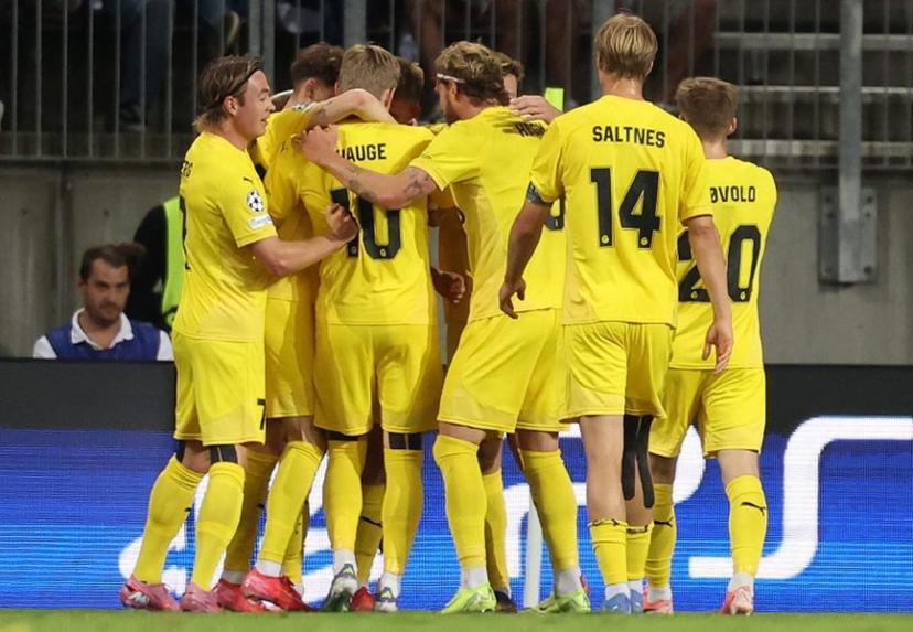 Bodo/Glimt players celebrate scoring the opening goal during the UEFA Champions League second-leg play-off football match between Sturm Graz and Bodo/Glimt at the Woerthersee Stadium in Klagenfurt, Austria on August 26, 2025.  ERWIN SCHERIAU / APA / AFP
