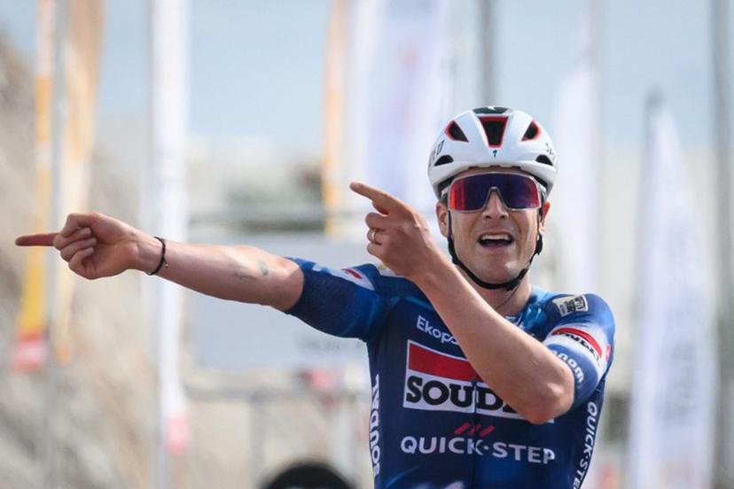 Soudal Quick-Step team's belgian rider Louis Vervaeke celebrates while crossing the finish line to win the second stage from Al Rustaq fort to Yitti Hills, of the Tour of Oman cycling race, on February 9, 2025.  Loic VENANCE / AFP