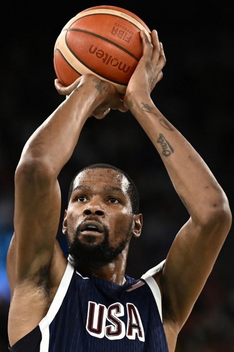 USA's #07 Kevin Durant takes a free throw in the men's quarterfinal basketball match between Brazil and the USA during the Paris 2024 Olympic Games at the Bercy  Arena in Paris on August 6, 2024.  Aris MESSINIS / AFP