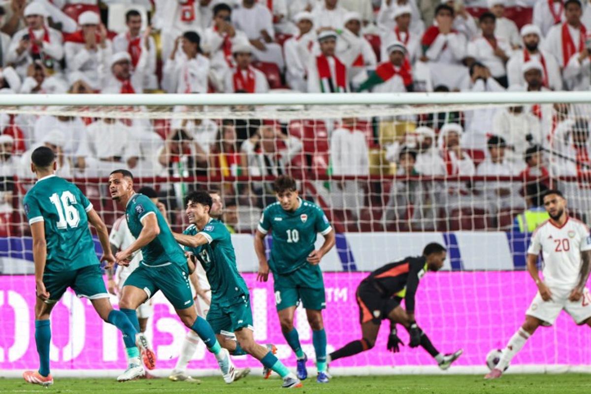 Iraq's midfielder #16 Amir Al-Ammari (2nd-L) celebrates scoring his team's first goal during the FIFA World Cup 2026 Asian qualifier football match between the United Arab Emirates and Iraq at the Mohammed bin Zayed Stadium in Abu Dhabi on November 13, 2025.  Fadel SENNA / AFP