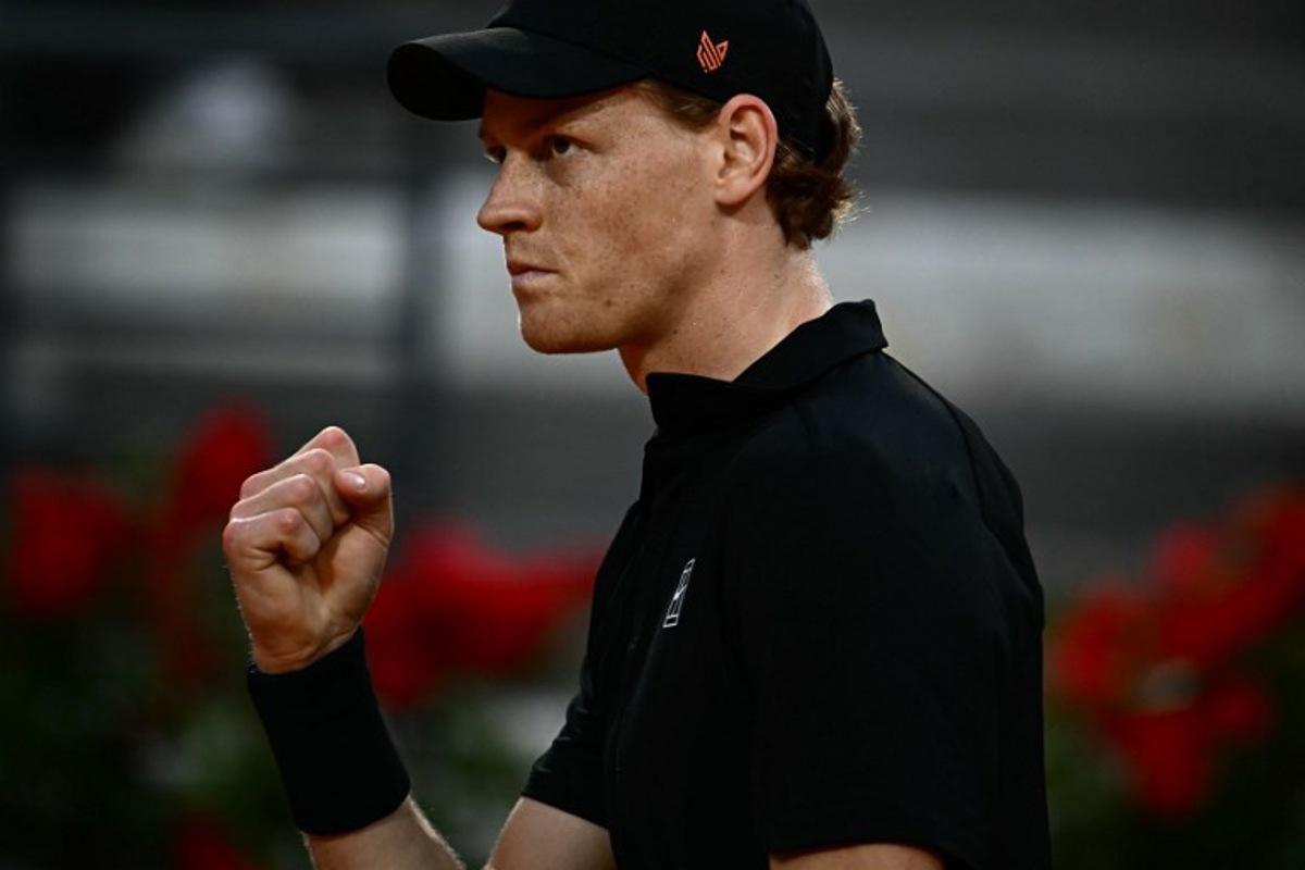 Italy's Jannik Sinner reacts during the men's singles quarter-final match against Norway's Casper Ruud at the ATP Rome Open tennis tournament at Foro Italico in Rome on May 15, 2025.   Filippo MONTEFORTE / AFP