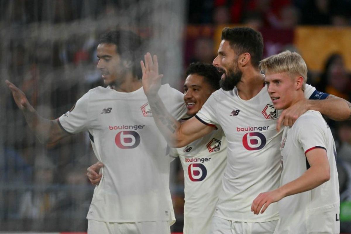 Lille's Icelandic midfielder #10 Hakon Arnar Haraldsson (R) celebrates with teammates after scoring Lille's first goal during the UEFA Europa League first round day 2 football match between AS Roma (ITA) and LOSC Lille (FRA) at the Olympic Stadium in Rome on October 2, 2025.  Filippo MONTEFORTE / AFP