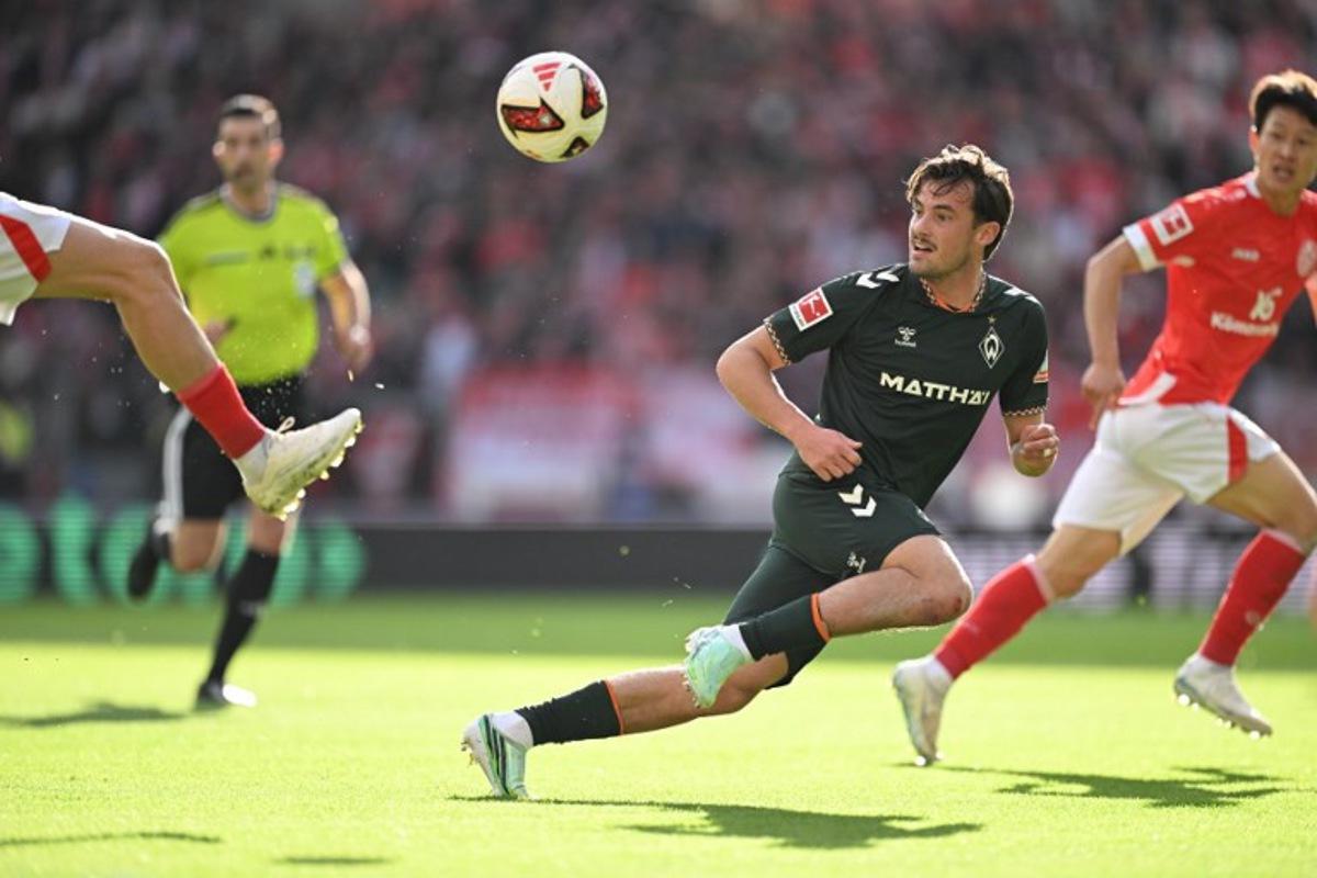 Bremen's Belgian defender #02 Olivier Deman eyes the ball during the German first division Bundesliga football match between Mainz 05 and Werder Bremen in Mainz on October 24, 2026.  Kirill KUDRYAVTSEV / AFP