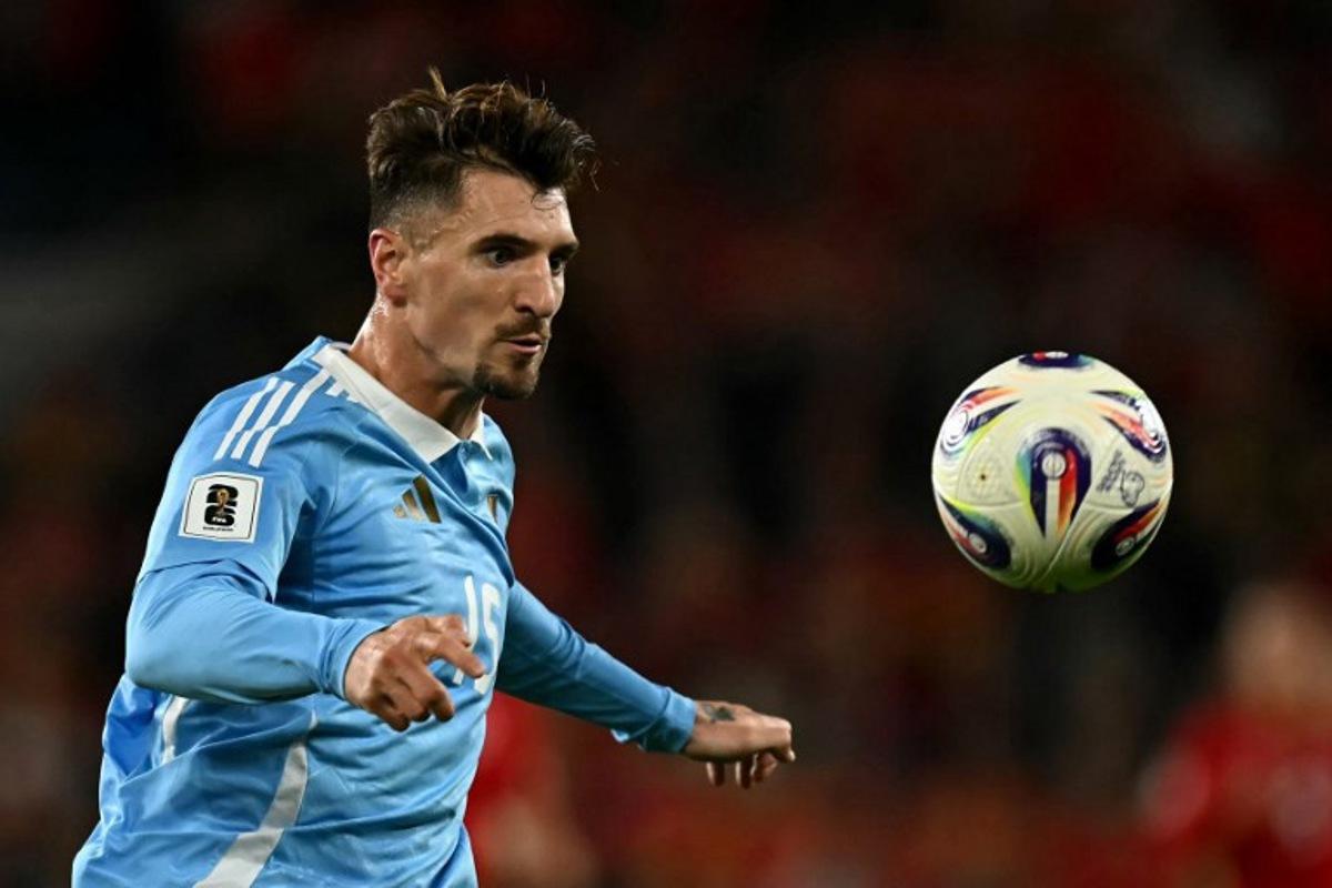 Belgium's defender #15 Thomas Meunier focuses on the ball during the 2026 World Cup Group J qualifier football match between Wales and Belgium, at Cardiff City Stadium, in Cardiff, on October 13, 2025.   Paul ELLIS / AFP