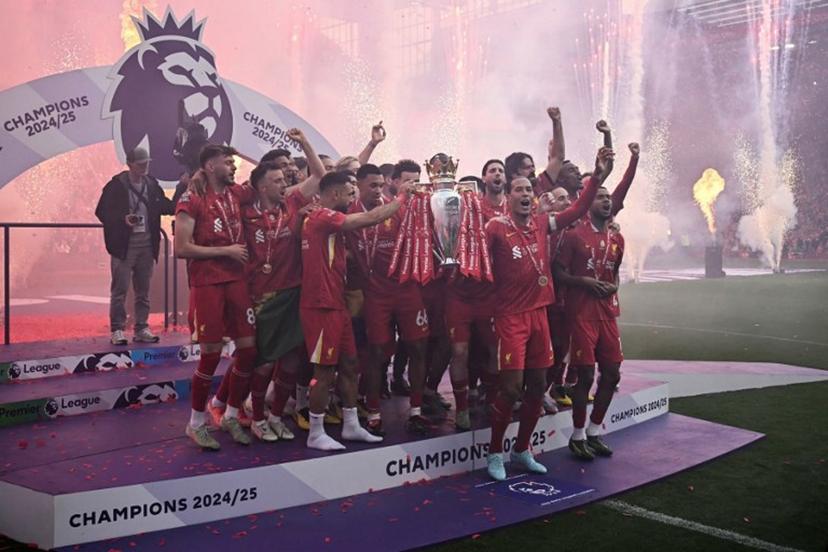 Liverpool's Dutch defender #04 Virgil van Dijk lifts the Premier League trophy at the end of the English Premier League football match between Liverpool and Crystal Palace at Anfield in Liverpool, north west England on May 25, 2025. Liverpool equalises 1 - 1 against Crystal Palace. Paul ELLIS / AFP