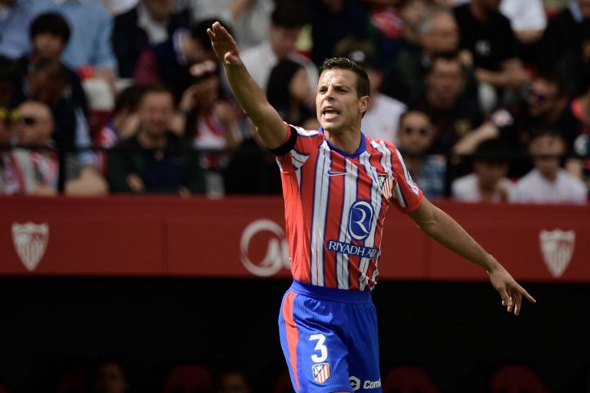 Atletico Madrid's Spanish defender #03 Cesar Azpilicueta gestures during the Spanish league football match between Sevilla FC and Club Atletico de Madrid at the Ramon Sanchez Pizjuan stadium in Seville on April 6, 2025.  CRISTINA QUICLER / AFP