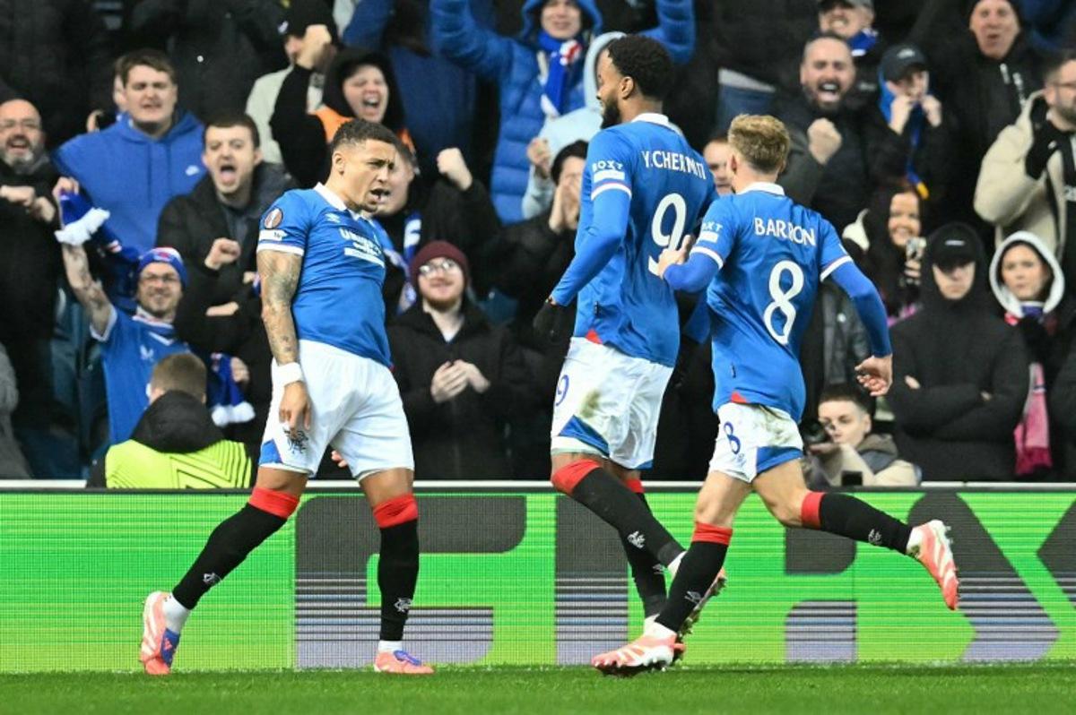 Rangers' English defender #02 James Tavernier celebrates scoring his team's first goal from the penalty spot during the UEFA Europa League league-stage football match between Rangers and CS Braga at the Ibrox Stadium in Glasgow on November 27, 2025.  ANDY BUCHANAN / AFP