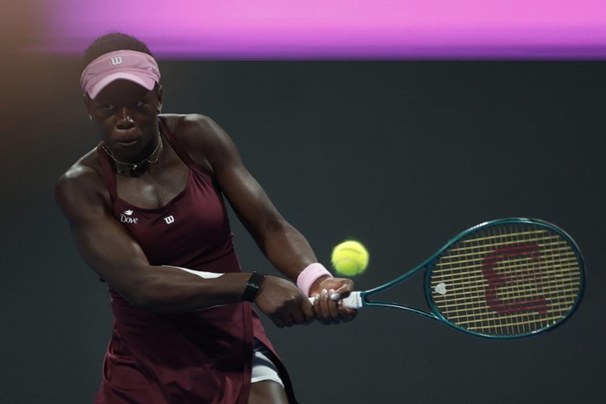Canada's Victoria Mboko hits a return against Latvia's Jelena Ostapenko during their women's singles semi-final match at the Qatar Open tennis tournament in Doha on February 13, 2026.  Karim JAAFAR / AFP