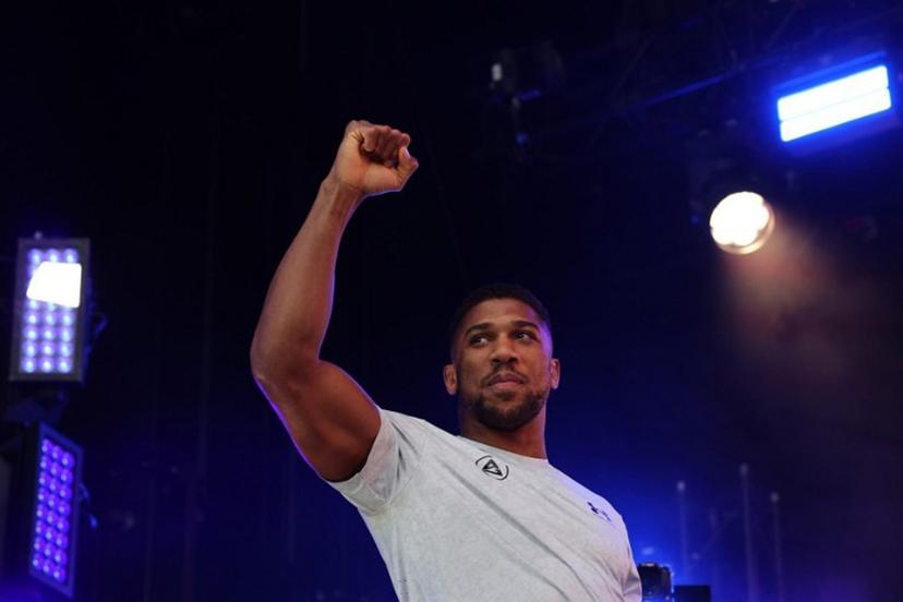 Britain's Anthony Joshua gestures as he arrives on stage for a public weigh-in in Trafalgar Square on September 20, 2024 on the eve of a heavyweight boxing match for the IBF world title in London. Daniel Dubois says he has to justify his status as IBF world heavyweight champion by showing he is the coming force in British boxing against Anthony Joshua at a sold-out Wembley on Saturday. The pair will battle it out in front of a reported post-war British record crowd of 96,000. Dubois won the interim IBF title in June and was elevated to world champion status when Oleksandr Usyk vacated.  Adrian Dennis / AFP