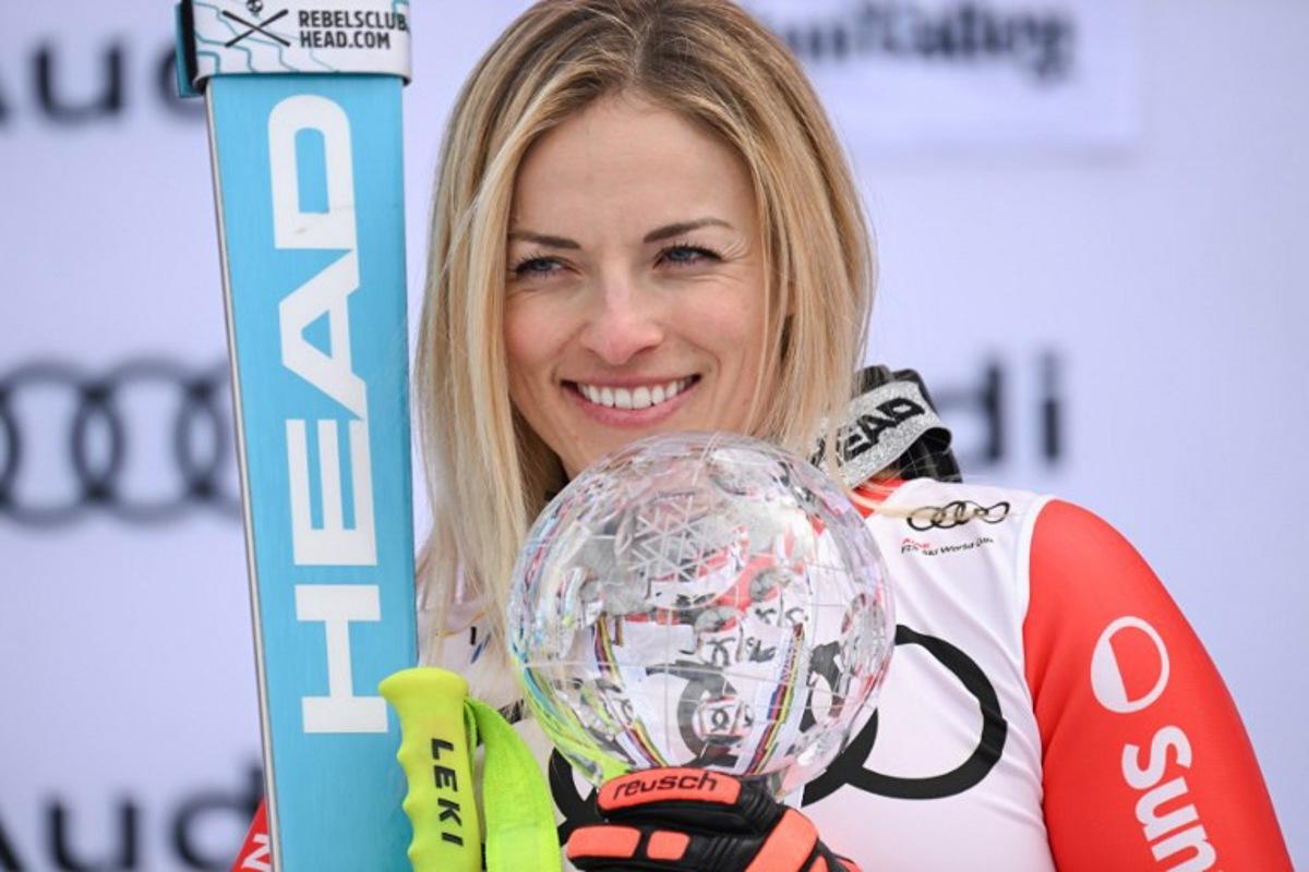 Overall champion Switzerland's Lara Gut-Behrami poses with the Crystal Globe on the podium of the season's overall Super-G winners of the FIS Alpine Skiing Women's World Cup at the Sun Valley Finals in Sun Valley, Idaho on March 23, 2025.  Patrick T. Fallon / AFP