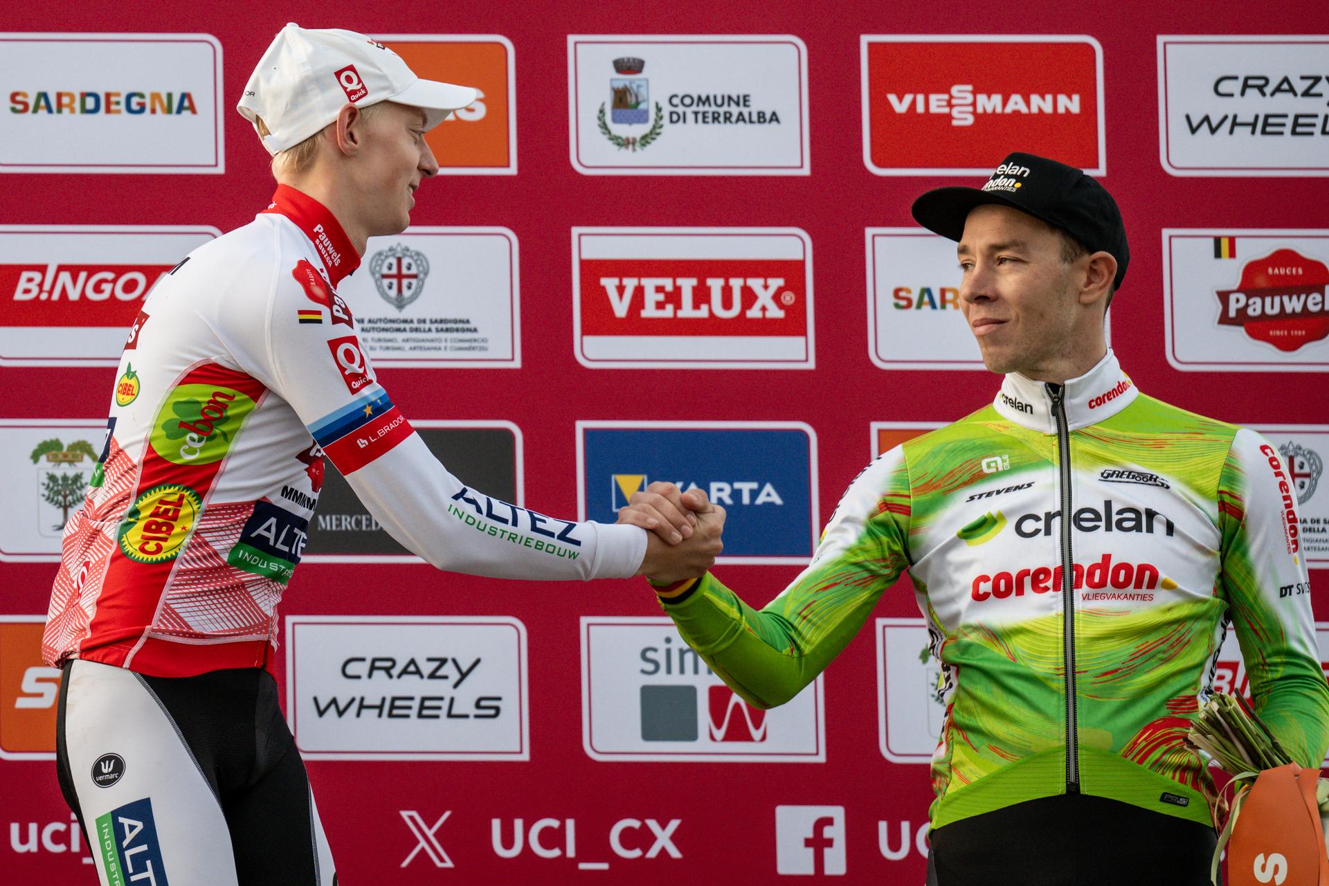 Belgian Michael Vanthourenhout and Belgian Laurens Sweeck pictured on the podium after the men's elite race of the Cyclocross World Cup, in Terralba, Sardinia, Italy, Sunday 07 December 2025, stage 3 (out of 12) in the World Cup of the 2026-2027 season. BELGA PHOTO DAVID PINTENS