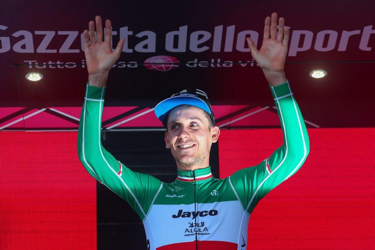 Team Jayco AlUla's Filippo Zana rider celebrates on the podium after winning the eighteenth stage of the Giro d'Italia 2023 cycling race, 161 km between Oderzo and Val di Zoldo, on May 25, 2023. . Luca Bettini / AFP