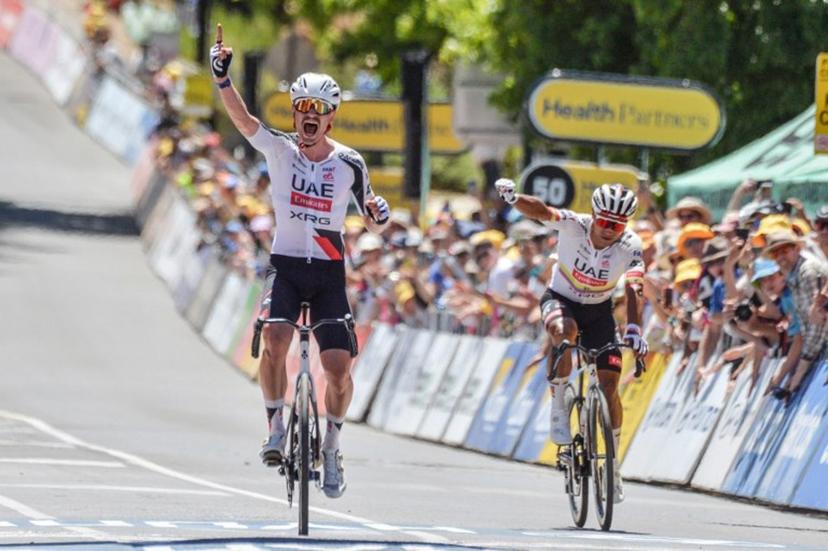 UAE Team Emirates XRG rider Jhonatan Narvaez from Ecuador (R) reacts as his teammate Australia's Jay Vine wins stage two of the Tour Down Under UCI men's cycling race in Adelaide on January 22, 2026.  Brenton Edwards / AFP