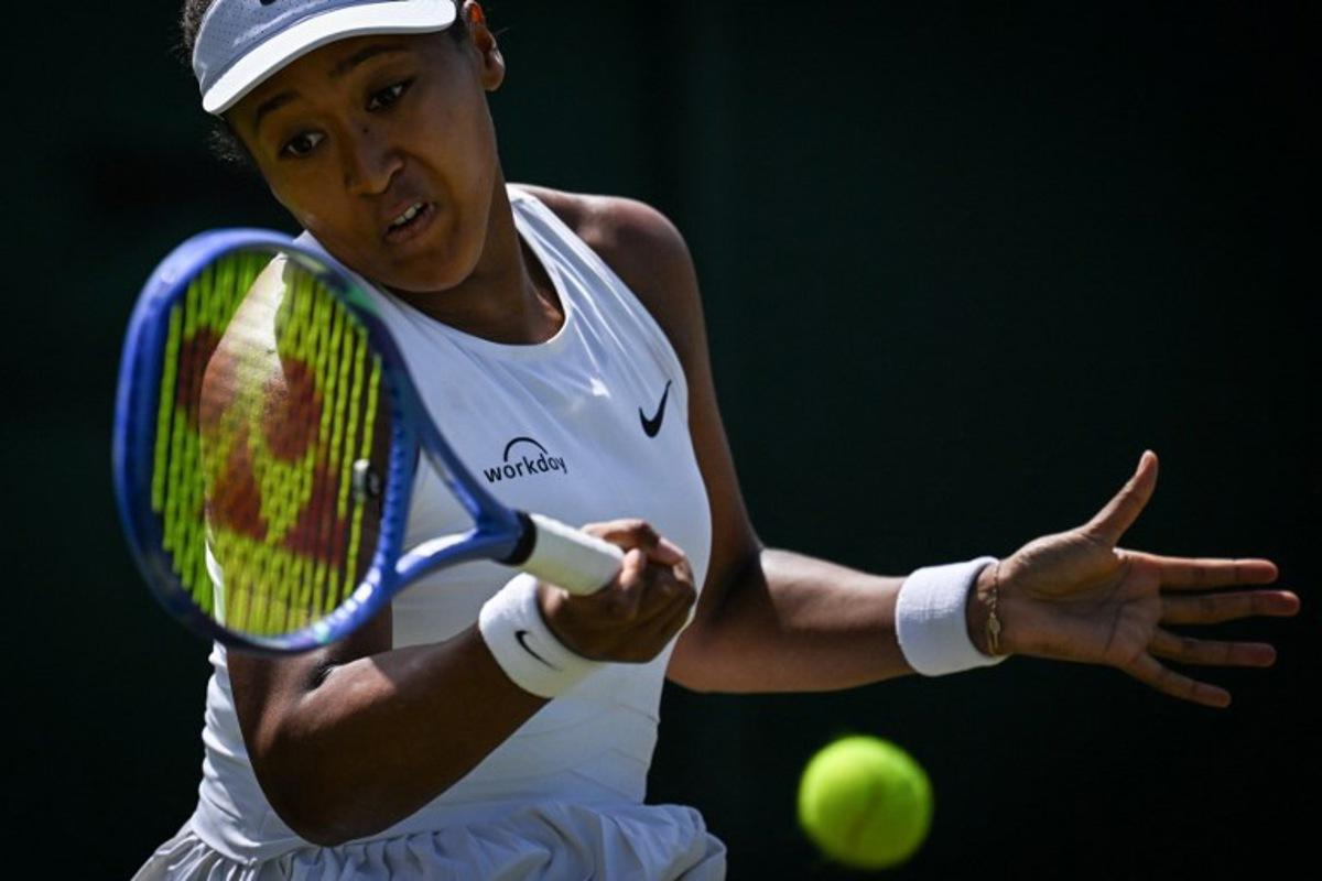 Japan's Naomi Osaka plays a forehand return to Russia's Anastasia Pavlyuchenkova during their women's singles third round tennis match on the fifth day of the 2025 Wimbledon Championships at The All England Lawn Tennis and Croquet Club in Wimbledon, southwest London, on July 4, 2025.  Kirill KUDRYAVTSEV / AFP