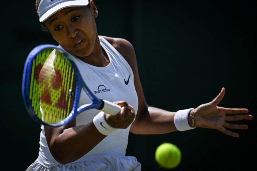 Japan's Naomi Osaka plays a forehand return to Russia's Anastasia Pavlyuchenkova during their women's singles third round tennis match on the fifth day of the 2025 Wimbledon Championships at The All England Lawn Tennis and Croquet Club in Wimbledon, southwest London, on July 4, 2025.  Kirill KUDRYAVTSEV / AFP