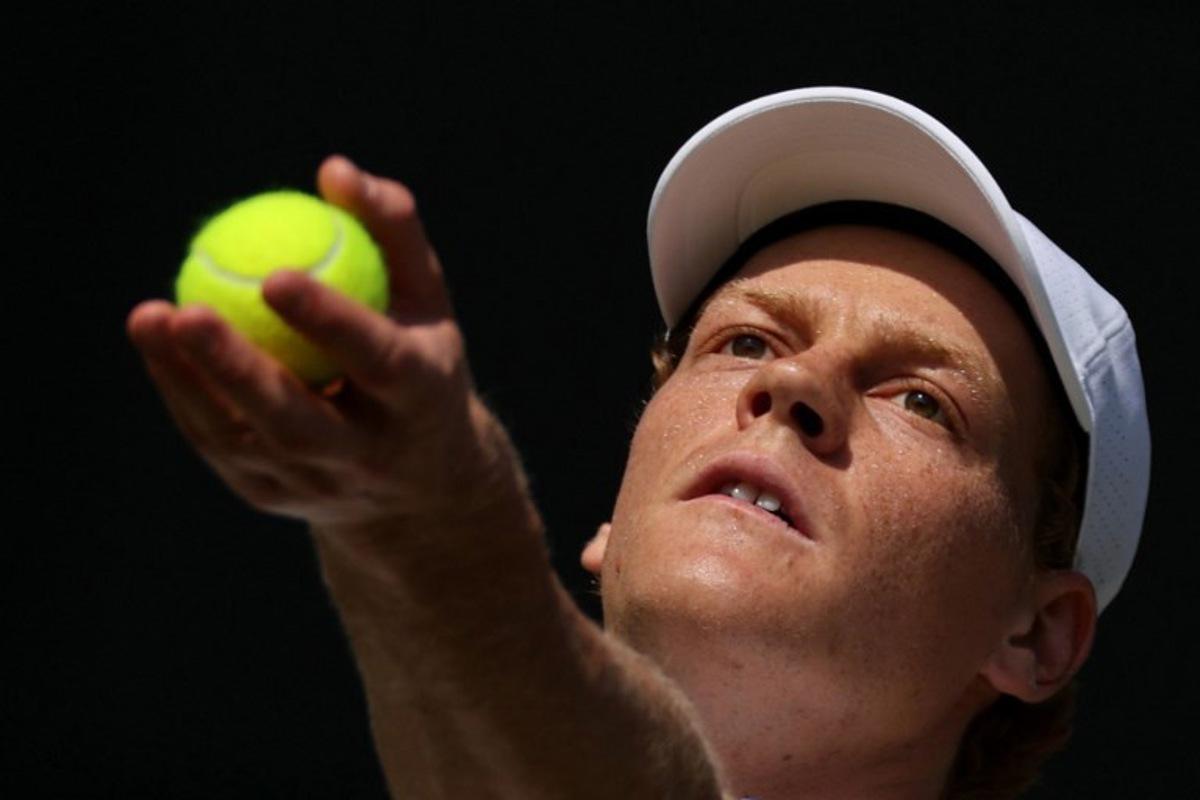 Italy's Jannik Sinner serves to US player Jenson Brooksby during their men's singles third round tennis match on the fifth day of the 2026 Wimbledon Championships at The All England Lawn Tennis and Croquet Club in Wimbledon, southwest London, on July 3, 2026.  Adrian DENNIS / AFP