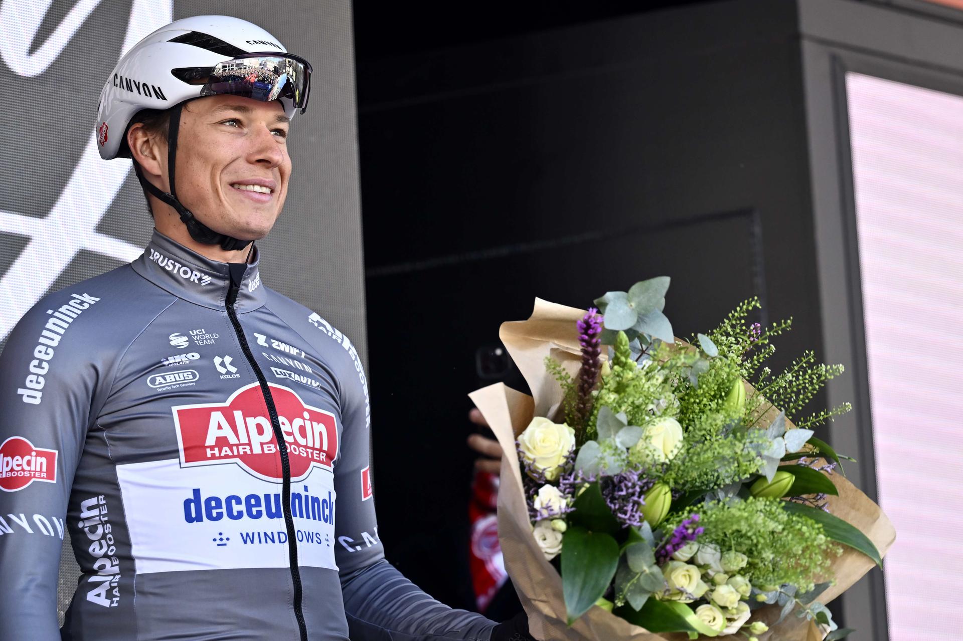Belgian Jasper Philipsen of Alpecin-Deceuninck receives flower on his birthday pictured during the team presentation ahead of the Kuurne-Brussels-Kuurne one day cycling race, 196,9 km from Kuurne to Kuurne via Brussels, Sunday 02 March 2025. BELGA PHOTO DIRK WAEM