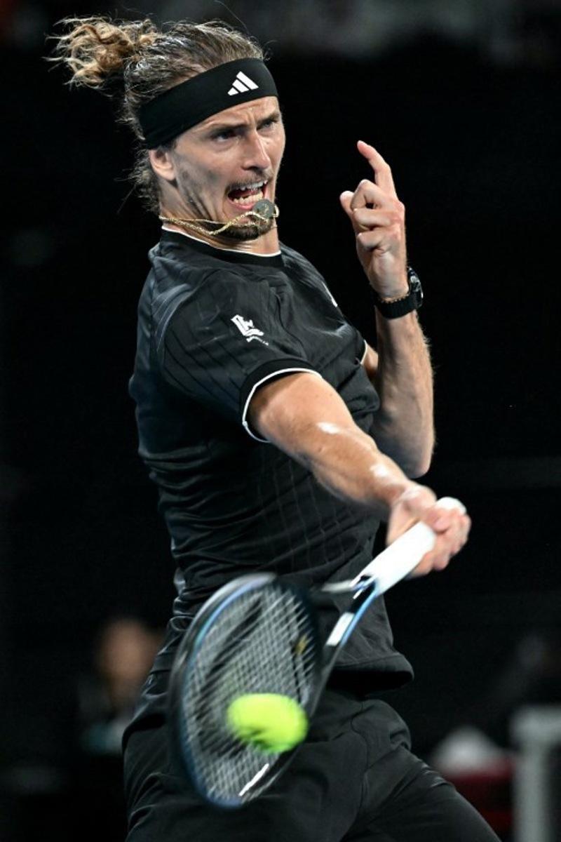 Germany's Alexander Zverev hits a return to France's Alexandre Muller during their men's singles match on day four of the Australian Open tennis tournament in Melbourne on January 21, 2026.  Paul Crock / AFP