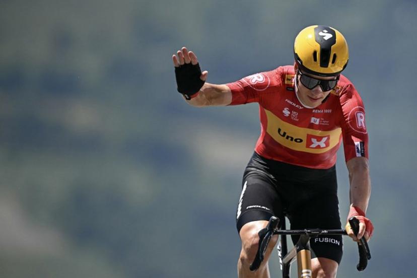 Uno-X Mobility team's Norwegian rider Jonas Abrahamsen cycles to the finish line of the 13th stage of the 112th edition of the Tour de France cycling race, 10.9 km individual time trial between Loudenvielle and Peyragudes, in the Pyrenees mountains of southwestern France, on July 18, 2025.  Loic VENANCE / AFP