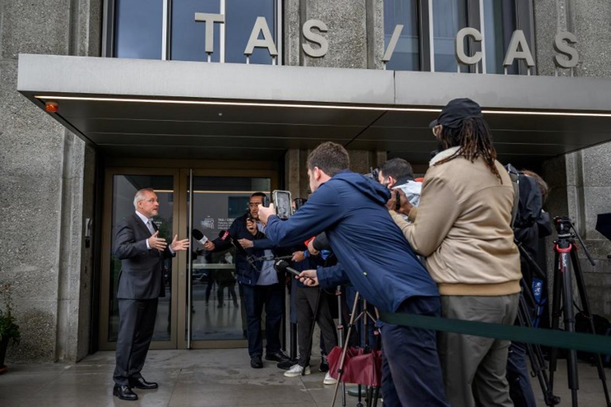 Court of Arbitration of Sport (CAS) director general Matthieu Reeb speaks to media during a hearing on Senegal's appeal against Morocco following a chaotic Africa Cup of Nations football final, in Lausanne on October 8, 2026. Nearly ten months after a chaotic Africa Cup of Nations final, the dispute is set to reach its conclusion in Lausanne, where the Court of Arbitration for Sport (CAS) will hear Senegal's appeal against Morocco being awarded the title. Senegal had initially won the January 18 final 1-0 after extra time, in a match marred by a lengthy walk-off over a controversial late penalty. Fabrice COFFRINI / AFP