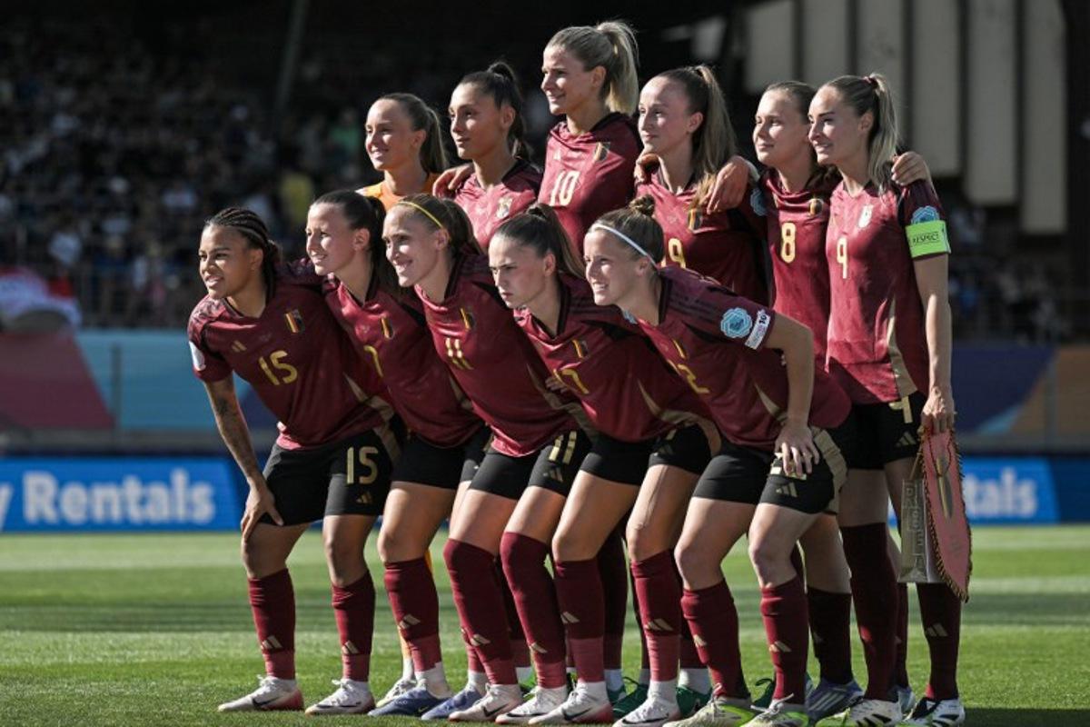 (From L) Belgium's midfielder #15 Mariam Toloba, Belgium's forward #07 Hannah Eurlings, Belgium's goalkeeper #21 Lisa Lichtfus, Belgium's defender #11 Janice Cayman, Belgium's defender #04 Amber Tysiak, Belgium's forward #17 Jill Janssens, Belgium's midfielder #10 Justine Vanhaevermaet, Belgium's defender #22 Laura Deloose, Belgium's defender #19 Sari Kees, Belgium's midfielder #08 Jarne Teulings and Belgium's forward #09 Tessa Wullaert, pose for a group photograph prior to the start of the UEFA Women's Euro 2025 Group B football match between Belgium and Italy at the Stade de Tourbillon in Sion, on July 3, 2025.  Fabrice COFFRINI / AFP