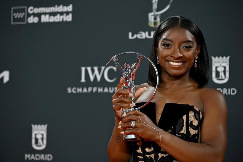 US gymnast Simone Biles poses with her Sportswoman of the Year Award during the 26th Laureus World Sports Awards gala in Madrid on April 21, 2025.  JAVIER SORIANO / AFP