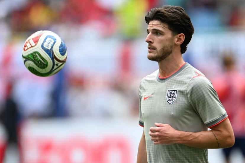 England's midfielder #04 Declan Rice warms up ahead of the 2026 World Cup football tournament quarter-final match between Norway and England at Miami Stadium in Miami Gardens on July 11, 2026.   MAURO PIMENTEL / AFP