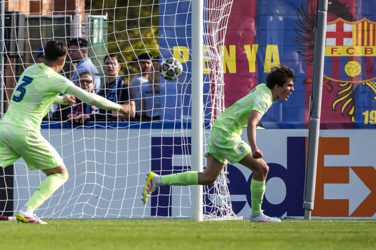 Barcelona's Spanish defender #4 Andres Cuenca (R) celebrates scoring his team's second goal next to teammate Swiss defender #3 Eman Kospo during  the UEFA Youth League final football match between Trabzonspor AS and FC Barcelona at the Colovray Sport Center in Nyon, on April 28, 2025.  Fabrice COFFRINI / AFP