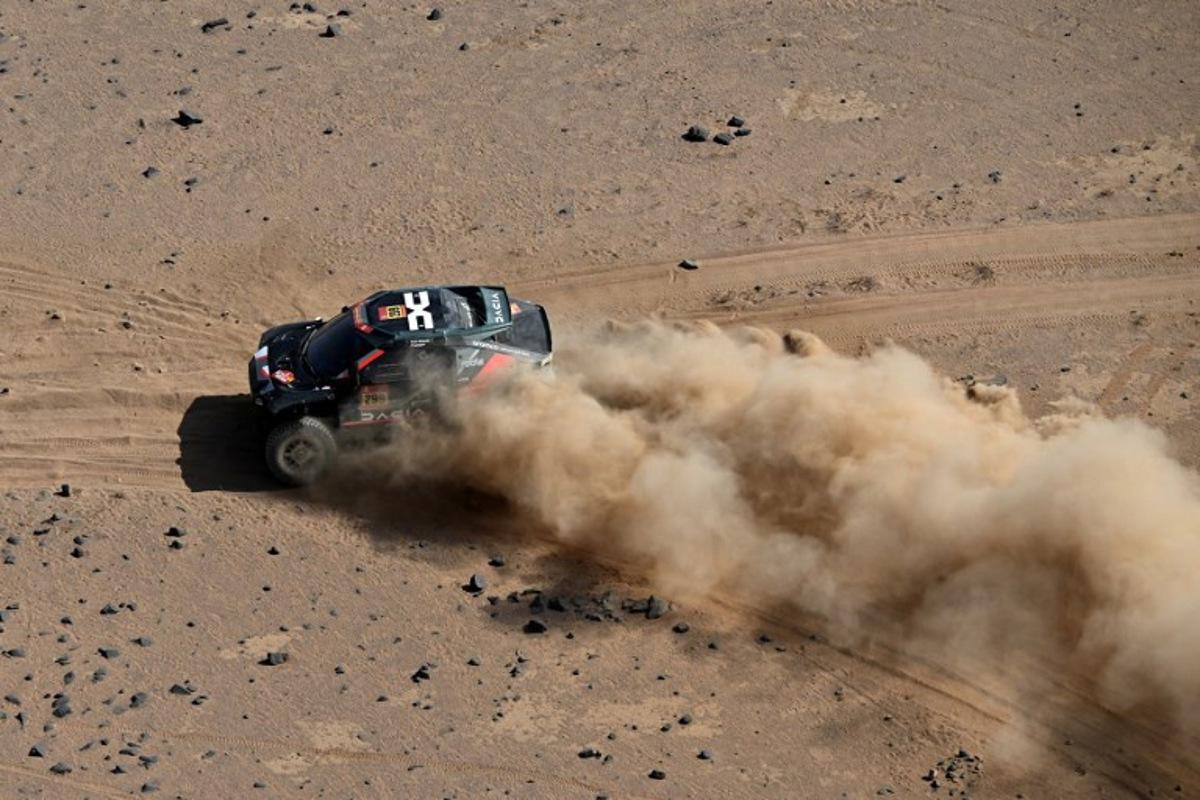 The Dacia Sandriders's Qatari driver Nasser Al‑Attiyah and Belgian co‑pilot Fabian Lurquin compete in Stage 11 of the 48th edition of the Dakar Rally 2026, between Bisha and al-Henakiyah, Saudi Arabia, on January 15, 2026.  Giuseppe CACACE / AFP