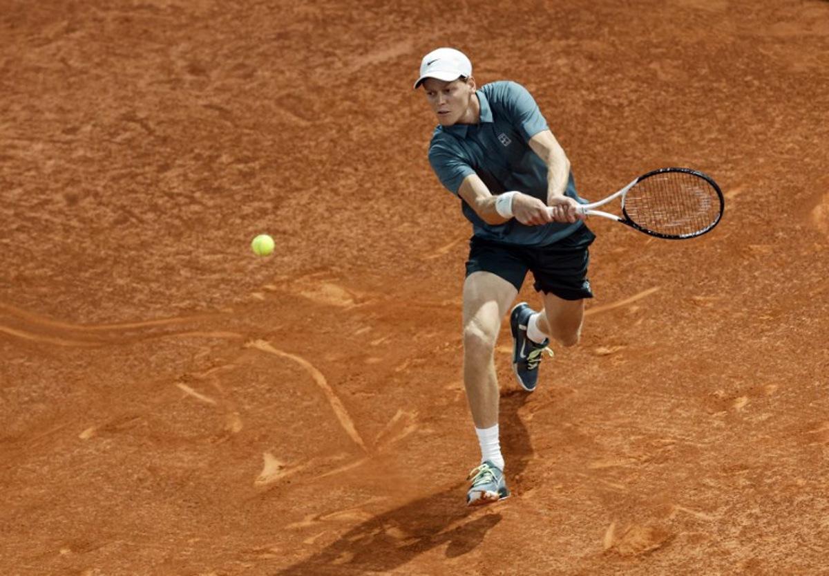 Italy's Jannik Sinner returns a ball to Spain's Rafael Jodar during their 2026 ATP Tour Madrid Open tennis tournament quarterfinal singles match at the Caja Magica in Madrid, on April 29, 2026.  OSCAR DEL POZO / AFP