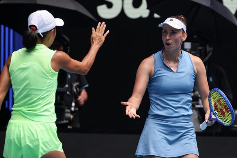 Belgium's Elise Mertens (R) gestures to partner China's Zhang Shuai during their women's doubles final match against Kazakhstan's Anna Danilina and Serbia's Aleksandra Krunic on day fourteen of the Australian Open tennis tournament in Melbourne on January 31, 2026.  DAVID GRAY / AFP