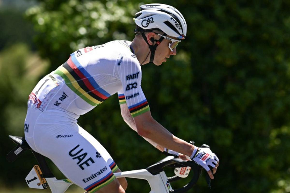 UAE Team Emirate - XRG team's Slovenian rider Tadej Pogacar cycles with the pack of riders (peloton) during the 12th stage of the 112th edition of the Tour de France cycling race, 180.6 km between Auch and Hautacam, in the Pyrenees mountains of southwestern France, on July 17, 2025.  Loic VENANCE / AFP