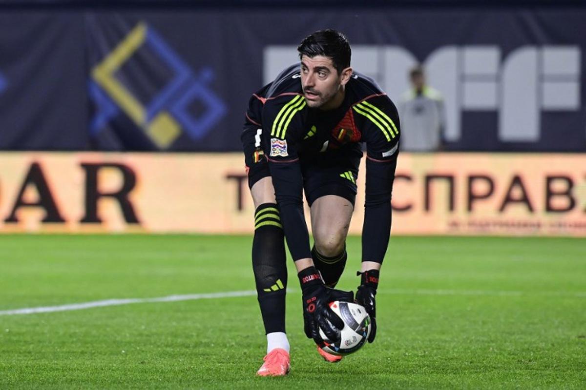 Belgium's goalkeeper #01 Thibaut Courtois takes the ball during the UEFA Nations League play-off first leg football match between Ukraine and Belgium at Enrique Roca stadium in Murcia, on March 20, 2025.  JOSE JORDAN / AFP