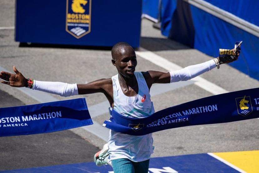 Kenyan distance runner John Korir crosses the finish line as he wins the men's race during the 129th Boston Marathon on April 21, 2025, in Boston, Massachusetts.  The marathon includes around 30,000 athletes from 129 countries running the 26.2 miles from Hopkinton to Boston, Massachusetts.  The event is the world's oldest annually run marathon.  Joseph Prezioso / AFP