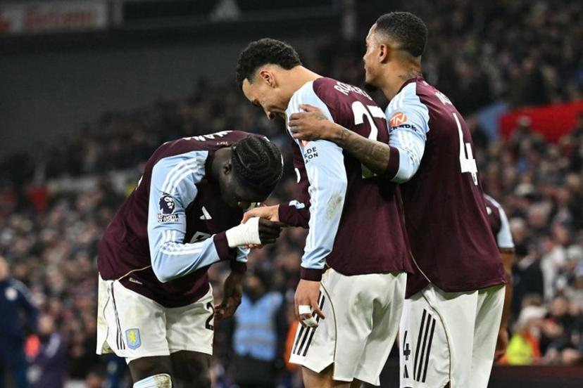 Aston Villa's English midfielder #27 Morgan Rogers (C) celebrates scoring his team's first goal to take the lead 1-0 during the English Premier League football match between Aston Villa and Manchester United at Villa Park in Birmingham, central England on December 21, 2025.  Ben STANSALL / AFP