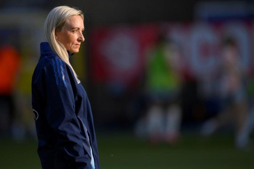 Belgium's Icelandic coach Elisabet Gunnarsdottir stands on the pitch as her players warm up before the start of the UEFA Women's Nations League group A3 football match between Belgium and Spain at the King Power at Den Dreef Stadium, in Leuven on May 30, 2025.  JOHN THYS / AFP