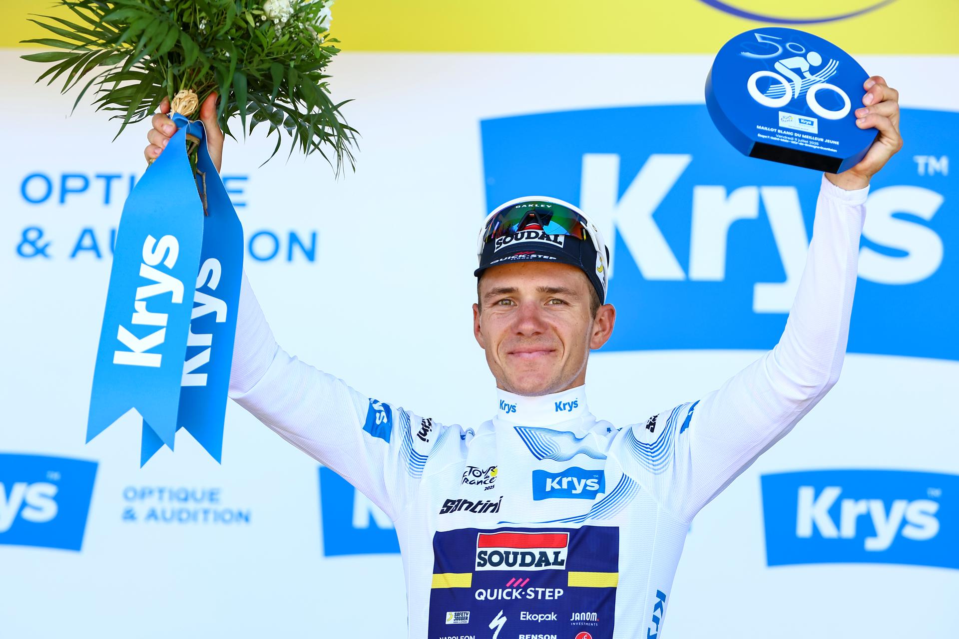 Belgian Remco Evenepoel of Soudal Quick-Step celebrates on the podium in the white jersey for best young rider after stage seven of the 2025 Tour de France cycling, from Saint-Malo to Mur-de-Bretagne (194 km), on Friday 11 July 2025 in France. The 112th edition of the Tour de France starts on Saturday 5 July in Lille, France, and will finish in Paris, France on the 27th of July. BELGA PHOTO DAVID PINTENS