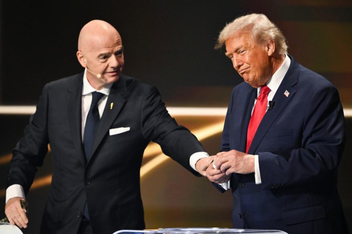 (L/R) FIFA President Gianni Infantino and US President Donald Trump participate in the draw for the 2026 FIFA Football World Cup taking place in the US, Canada and Mexico, at the Kennedy Center, in Washington, DC, on December 5, 2025.  Mandel NGAN / POOL / AFP