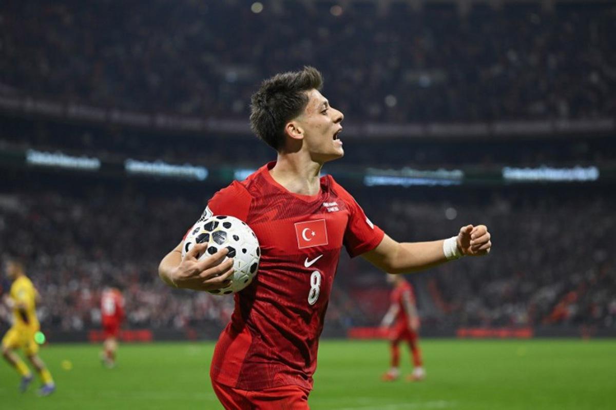 Turkey's midfielder #08 Arda Guler reacts during the play-off FIFA World Cup 2026 European qualification knockout semi-final football match between Turkey and Romania at Besiktas Park stadium, in Istanbul on March 26, 2026.  YASIN AKGUL / AFP