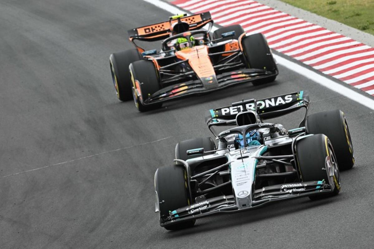 Mercedes' British driver George Russell and McLaren's British driver Lando Norris compete during the Formula One Hungarian Grand Prix at the Hungaroring circuit in Mogyorod near Budapest, Hungary, on August 3, 2025.  Attila KISBENEDEK / AFP