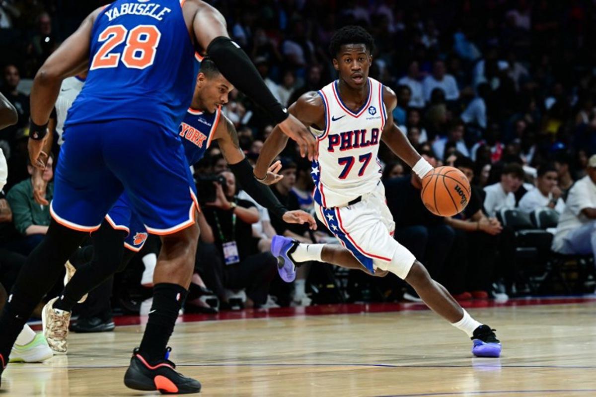 Philadelphia 76ers' #77 VJ Edgecombe dribbles the ball during the NBA basketball game between the New York Knicks and the Philadelphia 76ers at the Etihad Arena in Abu Dhabi on October 2, 2025.  Giuseppe CACACE / AFP