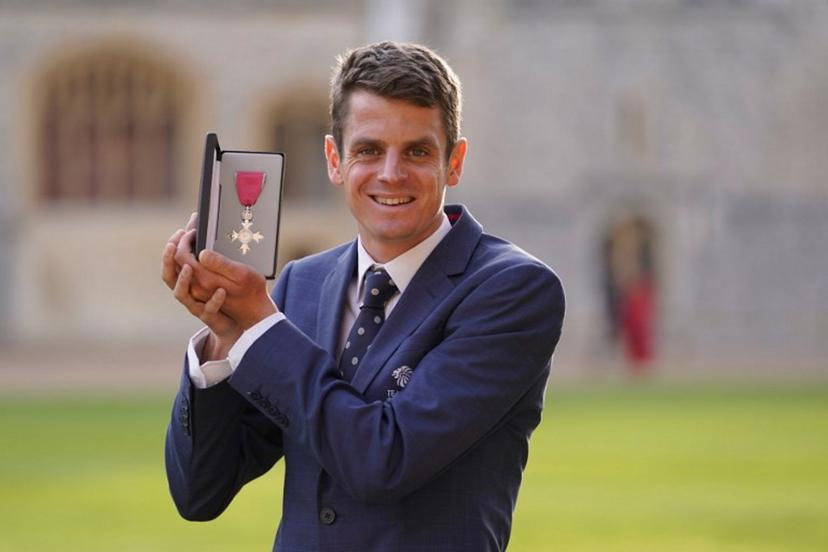 Athlete Jonathan Brownlee poses with his medal after being appointed a Member of the Order of the British Empire (MBE) during an investiture ceremony at Windsor, on October 18, 2022.  Andrew Matthews / POOL / AFP
