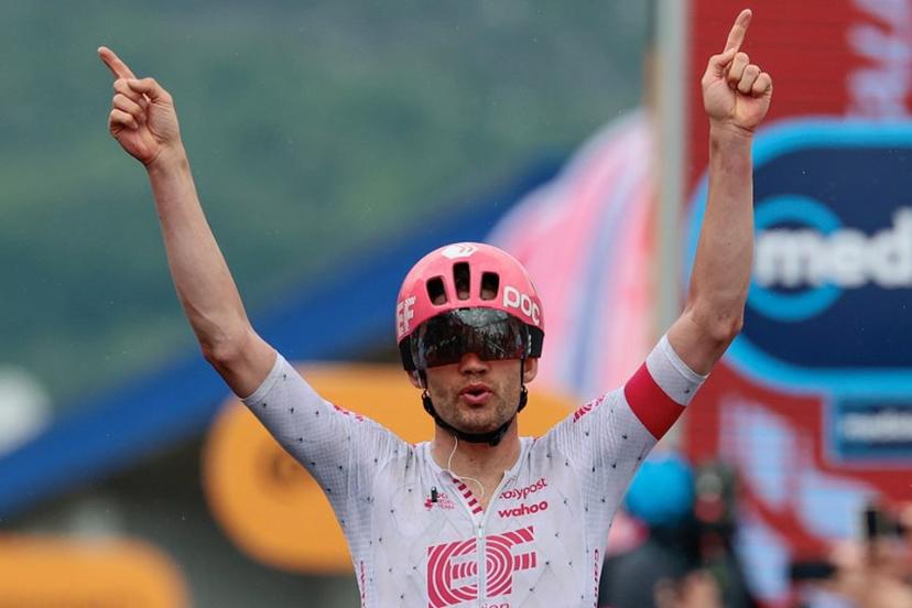 EF Education - EasyPost's Danish rider Kasper Asgreen celebrates after victory as he crosses the finish of the 14th stage of the 108th Giro d'Italia cycling race of 195kms from Treviso in Italy to Nova Gorica in Slovenia on May 24, 2025.  Luca Bettini / AFP