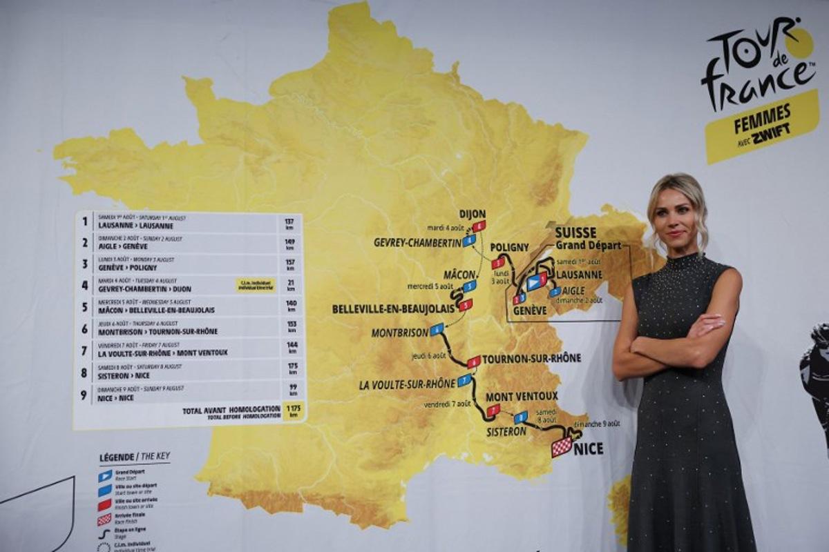 Director of the women's Tour de France cycling race Marion Rousse poses for a picture in front of the map showing the women's route during the presentation of the official routes of the 2026 edition of the men's and women's Tour de France cycling race in Paris on October 23, 2025.  Anne-Christine POUJOULAT / AFP