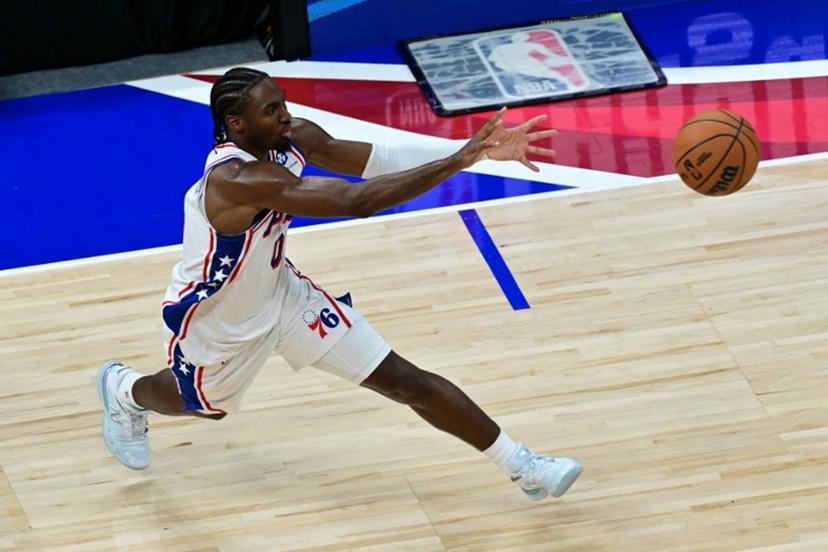 Philadelphia 76ers' #0 Tyrese Maxey receives a pass during the NBA basketball game between the New York Knicks and the Philadelphia 76ers at the Etihad Arena in Abu Dhabi on October 4, 2025.  Giuseppe CACACE / AFP