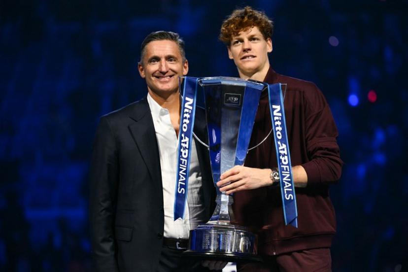ATP's President Andrea Gaudenzi (L) and Italy's Jannik Sinner pose during the trophy ceremony at the end of the men's single final match at the ATP Finals tennis tournament, in Turin, on November 16, 2025.  Marco BERTORELLO / AFP