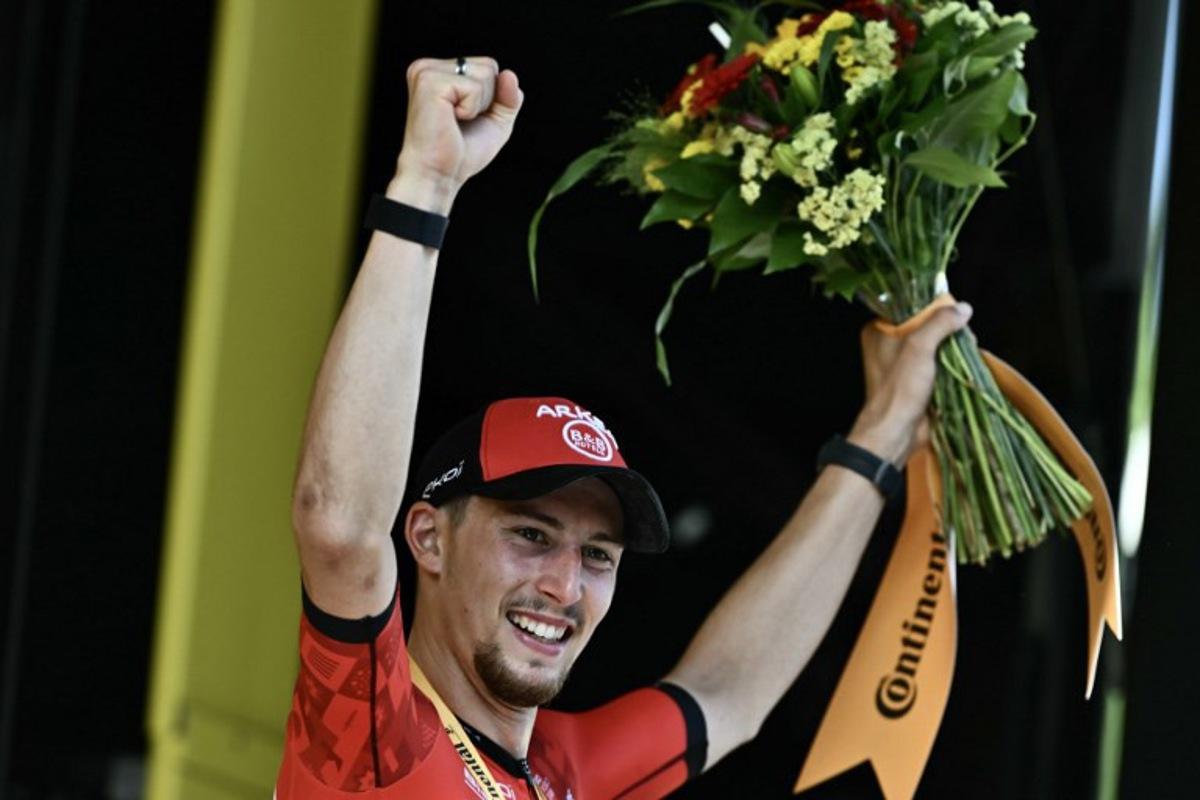 Arkea - B&B Hotels team's French rider Kevin Vauquelin celebrates on the podium after winning the 2nd stage of the 111th edition of the Tour de France cycling race, 199 km between Cesenatico and Bologna, in Italy, on June 30, 2024.  Marco BERTORELLO / AFP