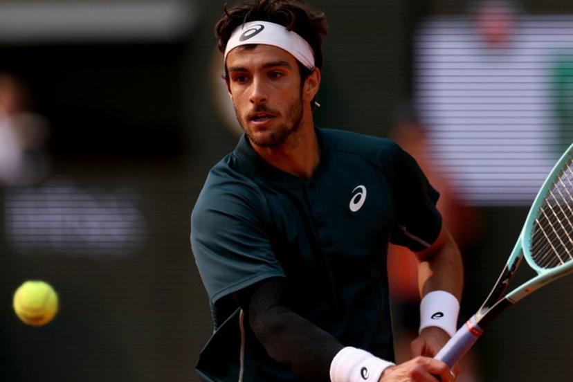 Italy's Lorenzo Musetti plays a backhand return to US Frances Tiafoe during their men's singles quarter-final match on day 10 of the French Open tennis tournament on Court Philippe-Chatrier at the Roland-Garros Complex in Paris on June 3, 2025.  ALAIN JOCARD / AFP