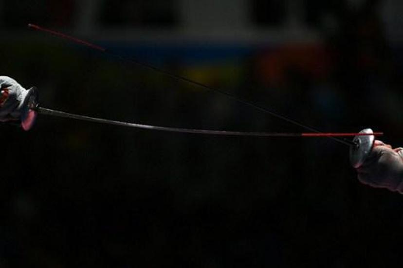 Russia's Timur Safin competes against China's Chen Haiwei during their men¿s individual foil quarter-final bout as part of the fencing event of the Rio 2016 Olympic Games, on August 7, 2016, at the Carioca Arena 3, in Rio de Janeiro. 
Kirill KUDRYAVTSEV / AFP