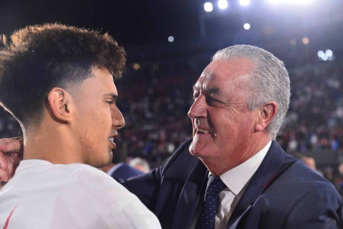 Paraguay's Argentine head coach Gustavo Alfaro (R) celebrates after the 2026 FIFA World Cup South American qualifiers football match between Paraguay and Ecuador at the Defensores del Chaco stadium in Asuncion on September 4, 2025.  Daniel DUARTE / AFP